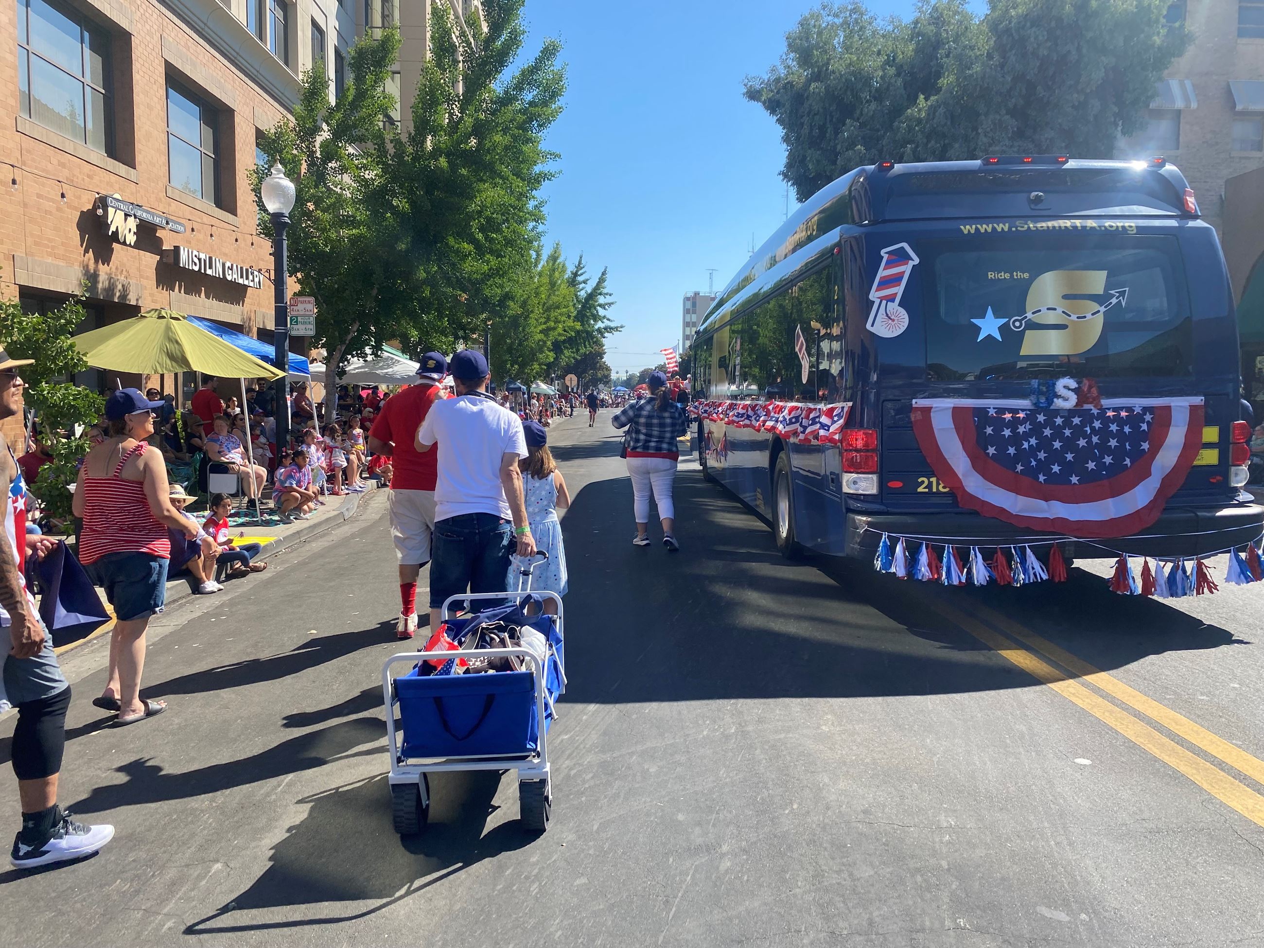 Image of The S bus in a Fourth of July parade.